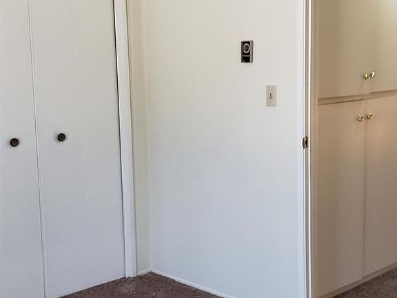 Two tall closets in this bedroom