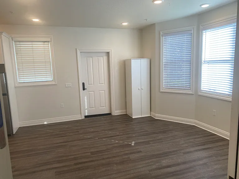 Large studio room gives lots of options for furniture placement (our staging is only one of many options)