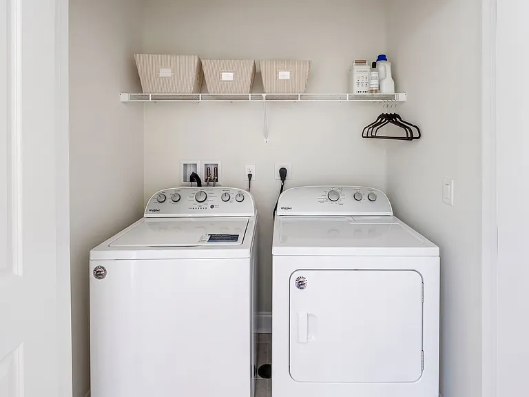 Laundry room space is conveniently situated in the upstairs hallway. Linen closet as well.