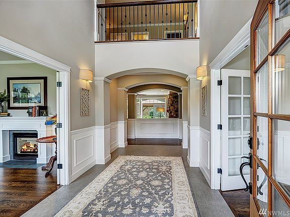 Two Story Foyer With Newer Flooring, Lighting Fixtures, And Crown Molding. Fresh Interior Paint Throughout The Home. Glass French Doors On Each Side Of The Foyer Lead To An Office And Sitting Room.