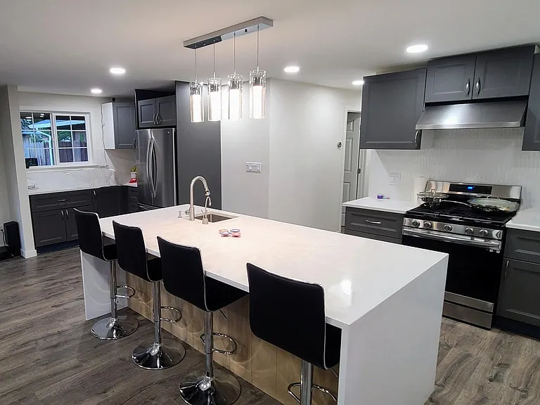 8 ft X 4 ft, waterfall edge Quartz island with seating for 4 (Stools stay with home)