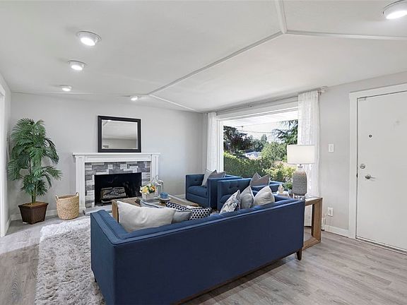 Walk into the front door and into the wonderful living room with large picture window that fills the room with natural light! Brand new luxury plank vinyl floors throughout!