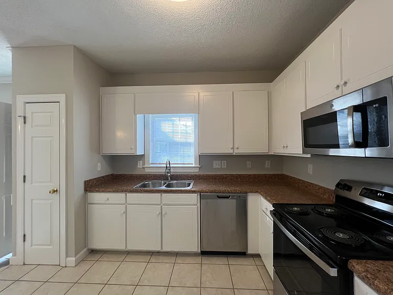 Kitchen... New Stainless Steel Refrigerator and NEW Stainless Steel Stove