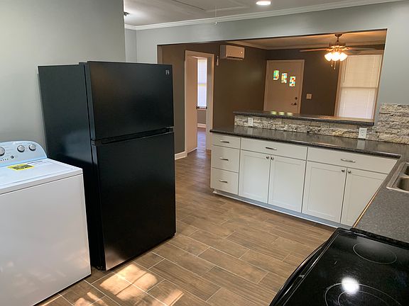 Kitchen. New refrigerator, new washer, dryer, dishwasher, microwave included.