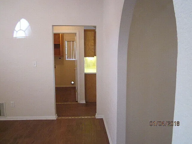 Formal dining to left, formal living to right with pretty arch walls kitchen & laundry straight ahead.