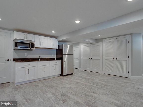 Kitchen and living space - Washer/Dryer unit thru closets to the right