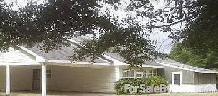 Back of Home
						:
						Shows carport and windows in the back of the great rm or lr/dr combo,part/porch.