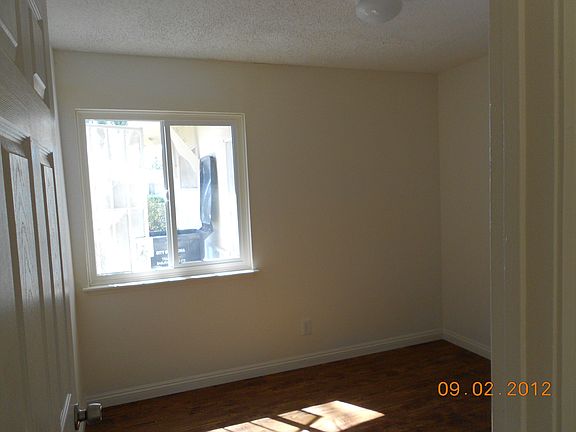 Fresh paint with new laminate wood flooring