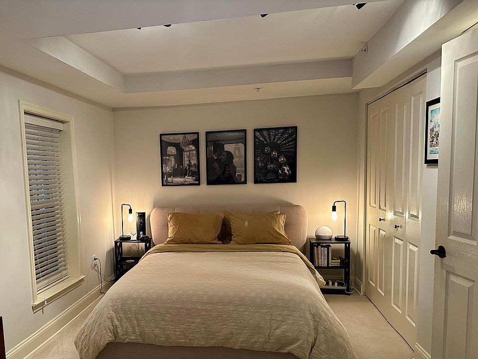 Large Warm Cozy Bedroom (10'x19') with tray ceiling on the lower level that can accommodate a king size (queen shown). New cream carpeting.