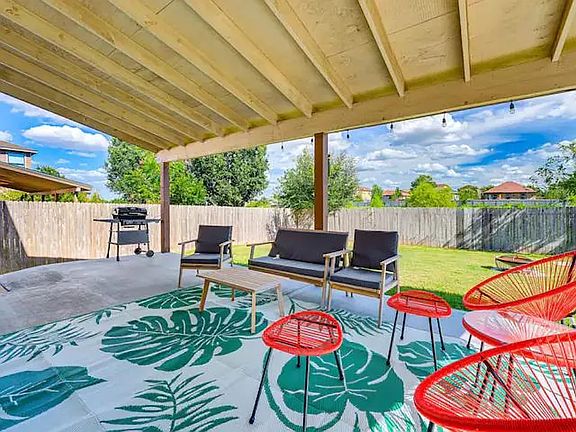 Backyard with outdoor furniture & fully grill set for family & friends to enjoy cooking out.
