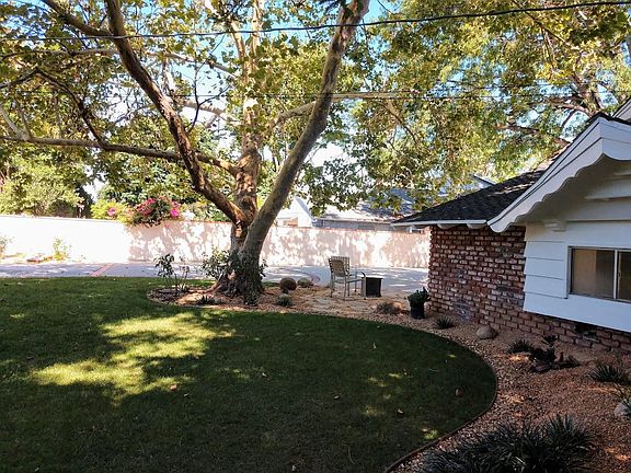 Front yard and flag stone pad