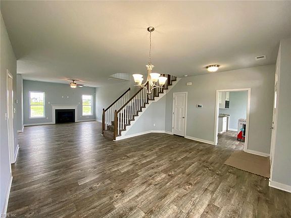 Dining room looking towards great room on left, in law suite entrance on right