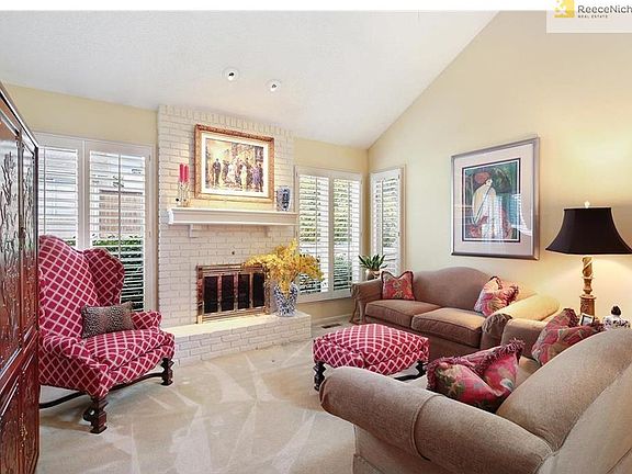 Large windows w/ plantation shutters in Great Room