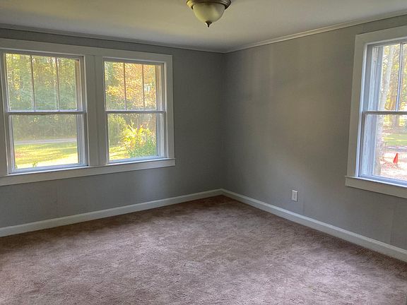 Master bedroom is bright and sunny with large windows. Custom closet arranged for maximum storage.