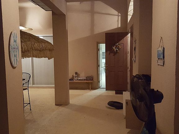 Front Doors opening onto pool patio. Mother-in-law suite on right