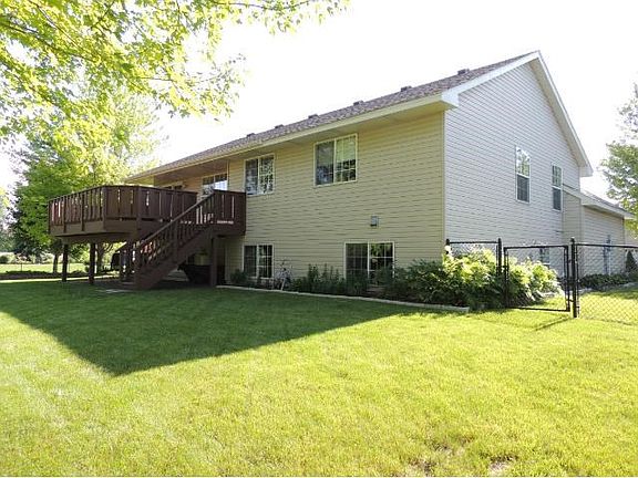 Level, spacious fenced backyard is perfect for gardens, children's play-sets, outdoor games, etc.