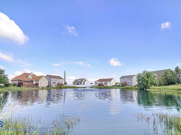 Neighborhood pond with fountain.