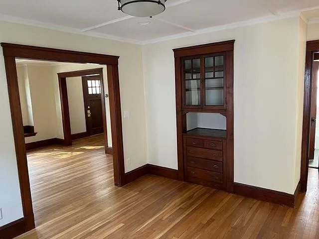 Dining room includes original built in cabinet.