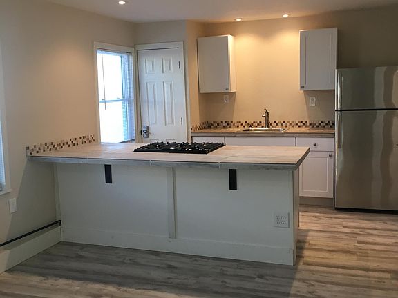 kitchen and breakfast bar, full size refrigerator