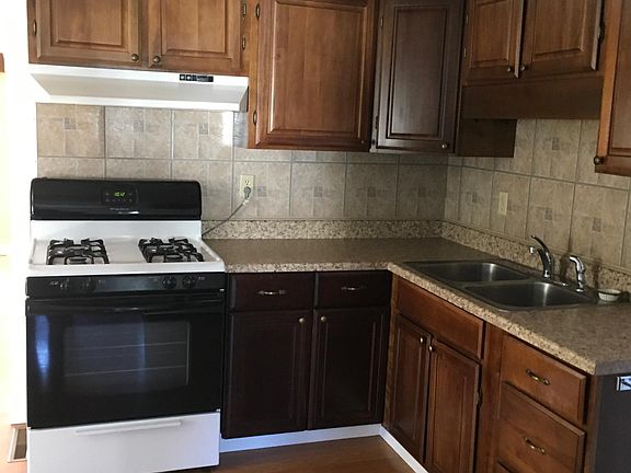 Kitchen with expansive cabinet room and oven/stove.