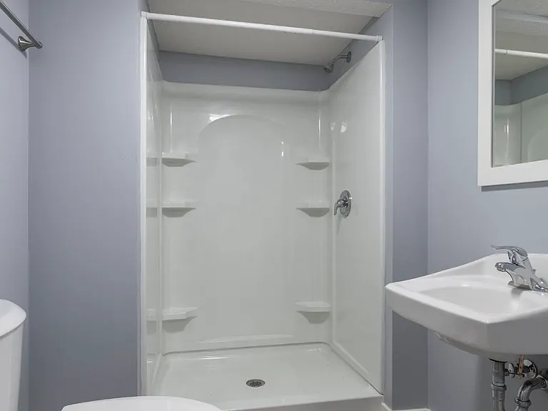 Walk-in shower at Park Avenue Apartments.