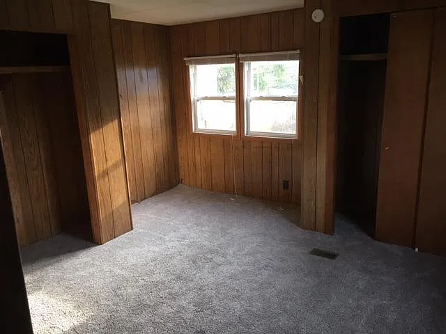 Master bedroom with connecting door to bathroom.