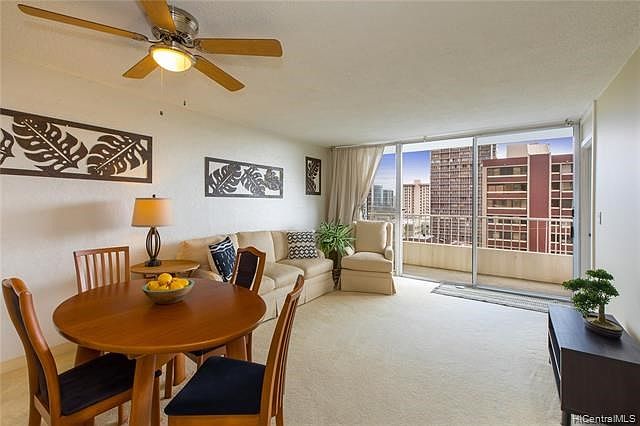 Large and spacious living room with great trade wind breezes. This third floor unit will make you fall in love with Honolulu. Secure and well kept building, CMU walls built to last and bedrooms separated by the living area.