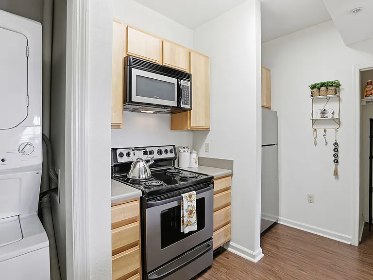 Cook with Ease in a Modern Kitchen with Stainless Steel Appliances at Legacy Student Living