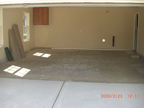 view from big side load driveway into painted garage