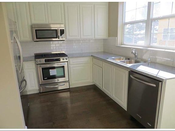 Kitchen (Kitchen Aid appliances - Dishwasher, Fridge, Oven, Microwave), Granite counter tops, hardwood floor