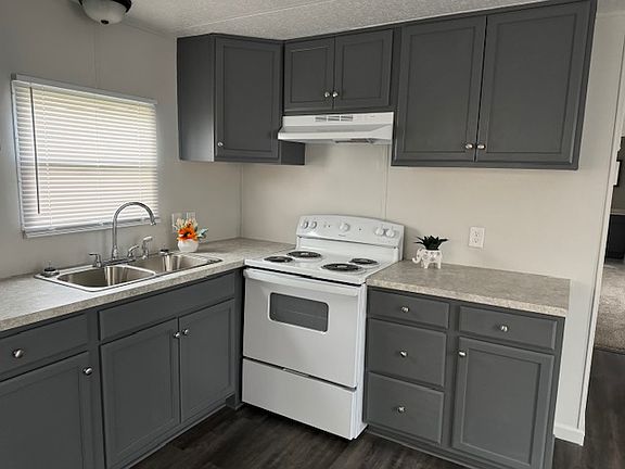Kitchen with new stove, sink and cabinets