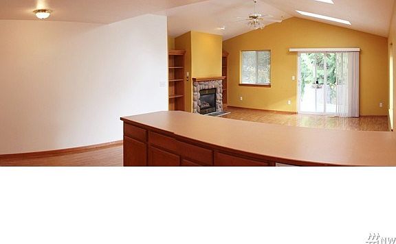 Kitchen offers huge eating bar and is open to the great room.