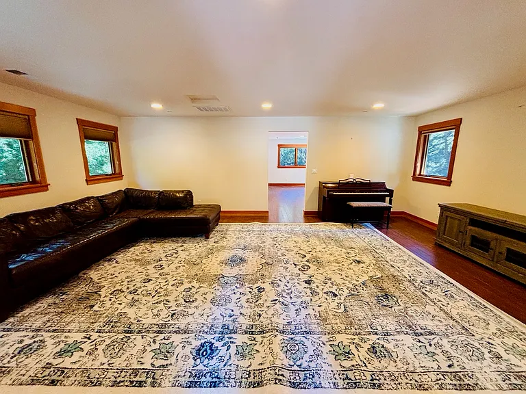 View of LR from door, rug and furnishings available