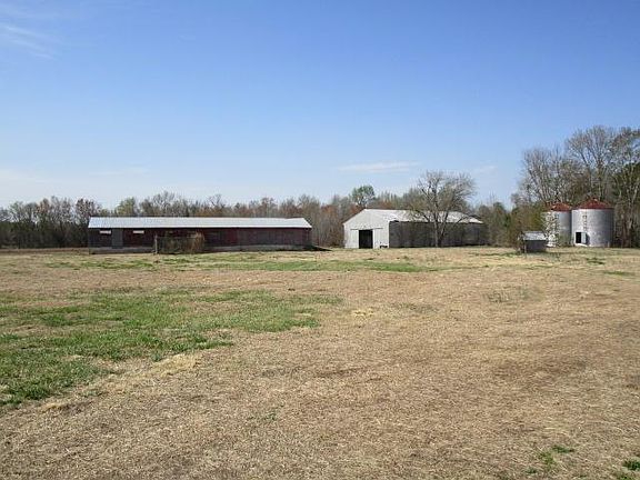 Tractor shelter with horse stalls, old hog house for storage
