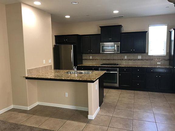 Kitchen area with bar/counter seating