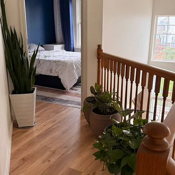 VIEW OF BEDROOM 2 FROM SECOND FLOOR STAIRS LANDING