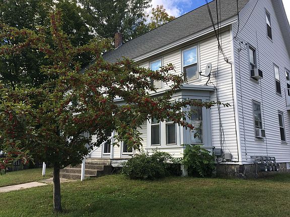 Front of the building and an ornamental tree