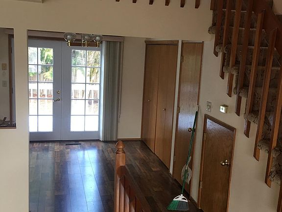 Looking towards dinning area, big folding doors open to wash