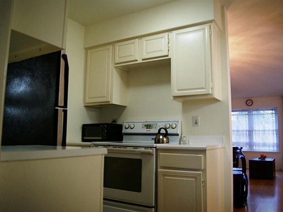 Light Kitchen with white appliances, can open and expand!