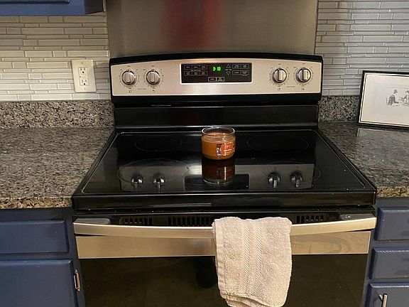 Stainless stove, stainless range hood. Real granite counters. My tenant's kitchen towel is 25 cents extra a month. HA!