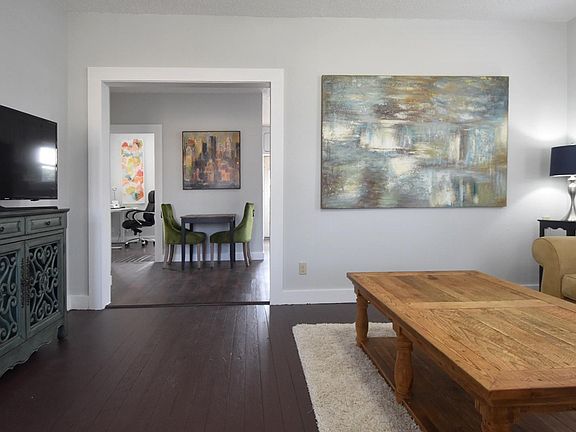 Sitting room looking into dining room and bedroom 2/office beyond