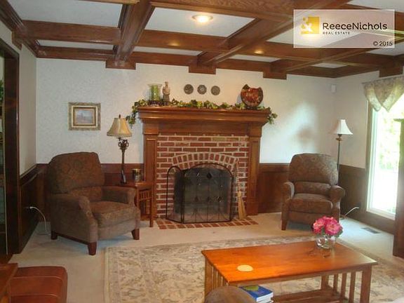 Warm inviting Family Room with box beamed ceiling.