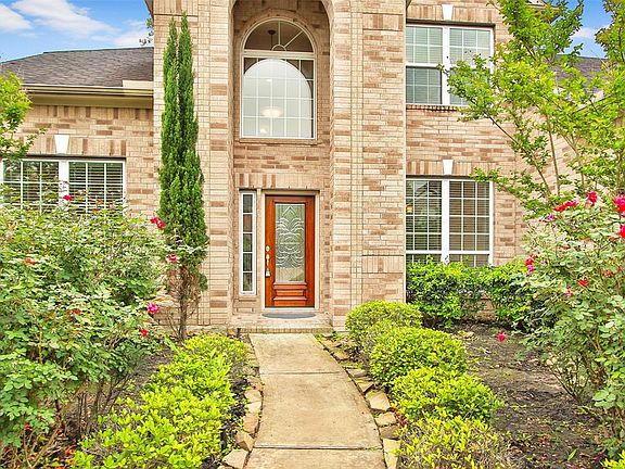 The window to the left is the vaulted office and to the right the dining room. The upstairs window is a secondary bedroom.