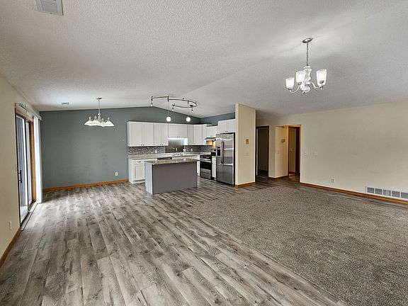 Alternate view of kitchen and living room.