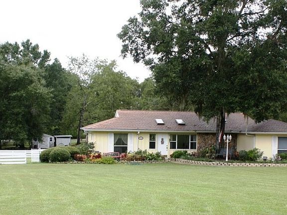 1.25 acres of beautifully landscaped lawn & gardens