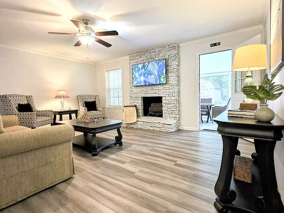 Spacious dining room with seamless flow to both the living room and kitchen