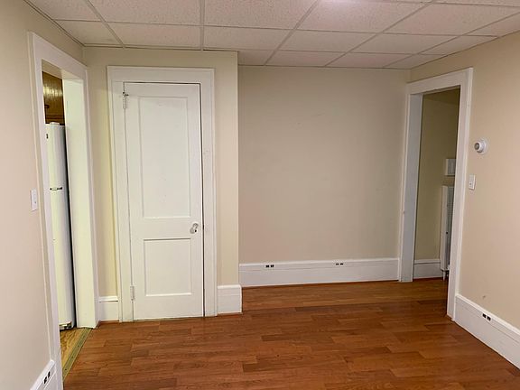 living room with closet view facing interior wall