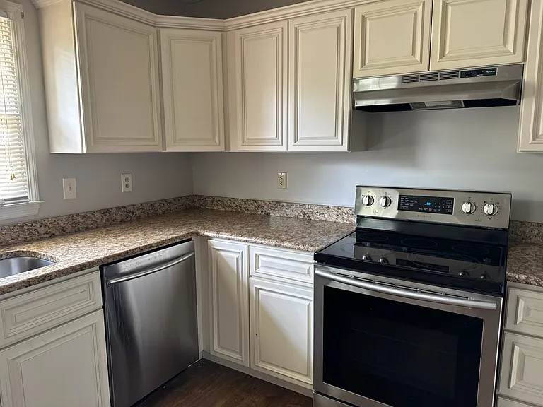 Updated kitchen with stainless steel appliances and granite countertops. New floors to be installed by 10 July.