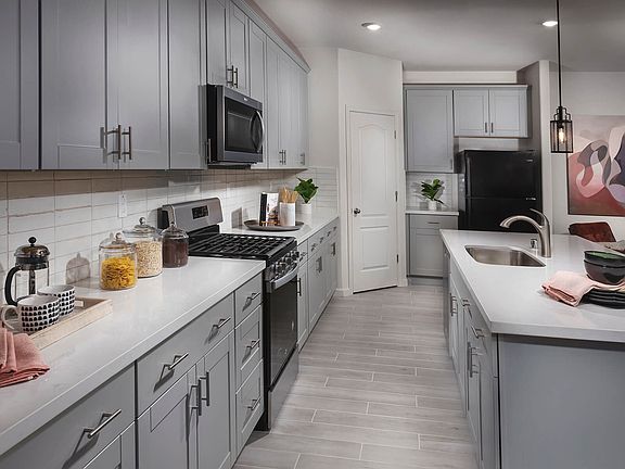 Residence 2 kitchen modeled at a nearby Meritage community.