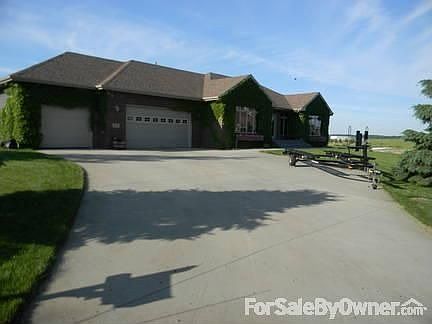 Huge driveway. Single garage is extended and shelves throughout.